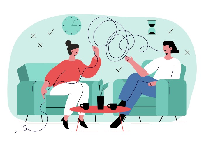 2 personnes assises dans fauteuil discutant